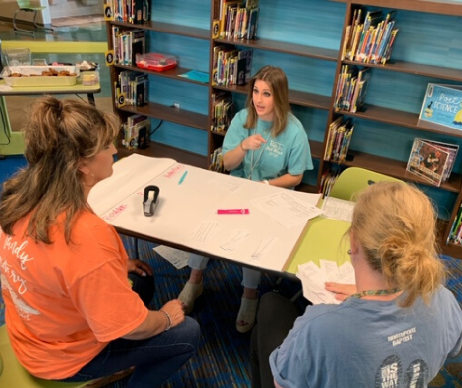 BSE teachers meeting at a table. BSE teachers meeting at a table.